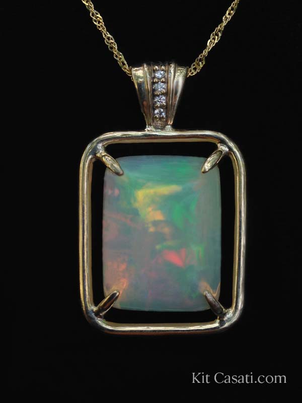 Ethiopian opal pendant with diamonds, in 14k yellow gold. By Kit Casati.